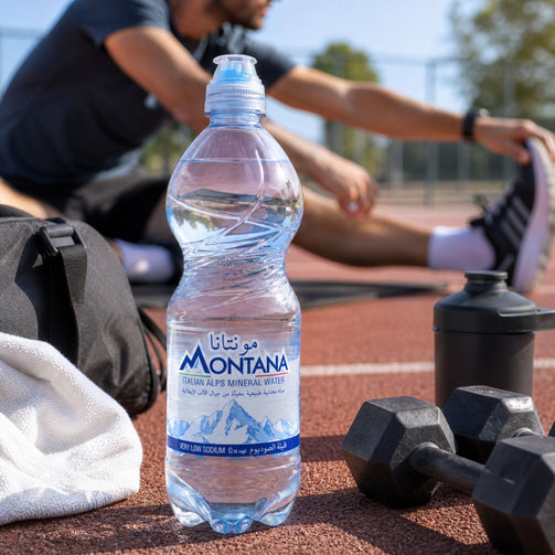 Montana water bottle on a track with a person stretching in the background